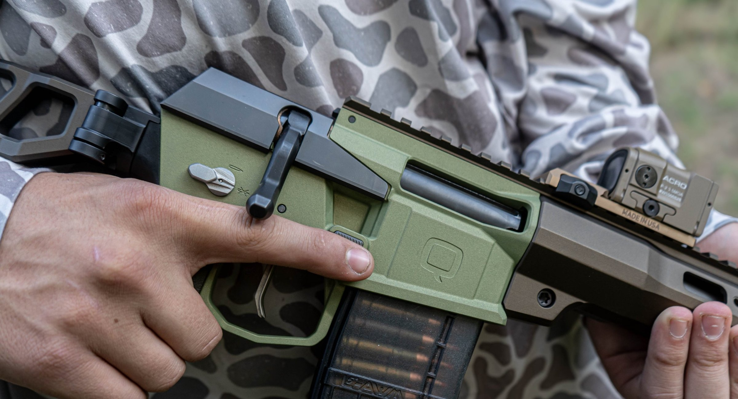 A young shooter with trigger finger indexed straight along the frame